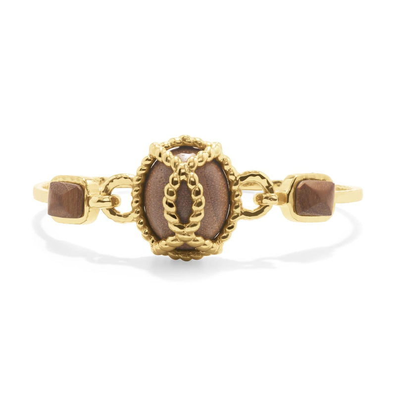 Inspired by my globe-trekking and fabulous French aunt, this classic chain bracelet personifies her effortless-yet-impeccable style that she achieves everyday. Featuring a subtly ornate gold motif complemented by earthy teak beads, this bracelet is perfect for life’s many adventures, from museum galas to mountaintop picnics.
