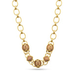 Inspired by my globe-trekking and fabulous French aunt, this classic chain necklace personifies her effortless-yet-impeccable style that she achieves everyday. Featuring a subtly ornate gold motif complemented by earthy teak beads, this necklace is perfect for life’s many adventures, from museum galas to mountaintop picnics.
